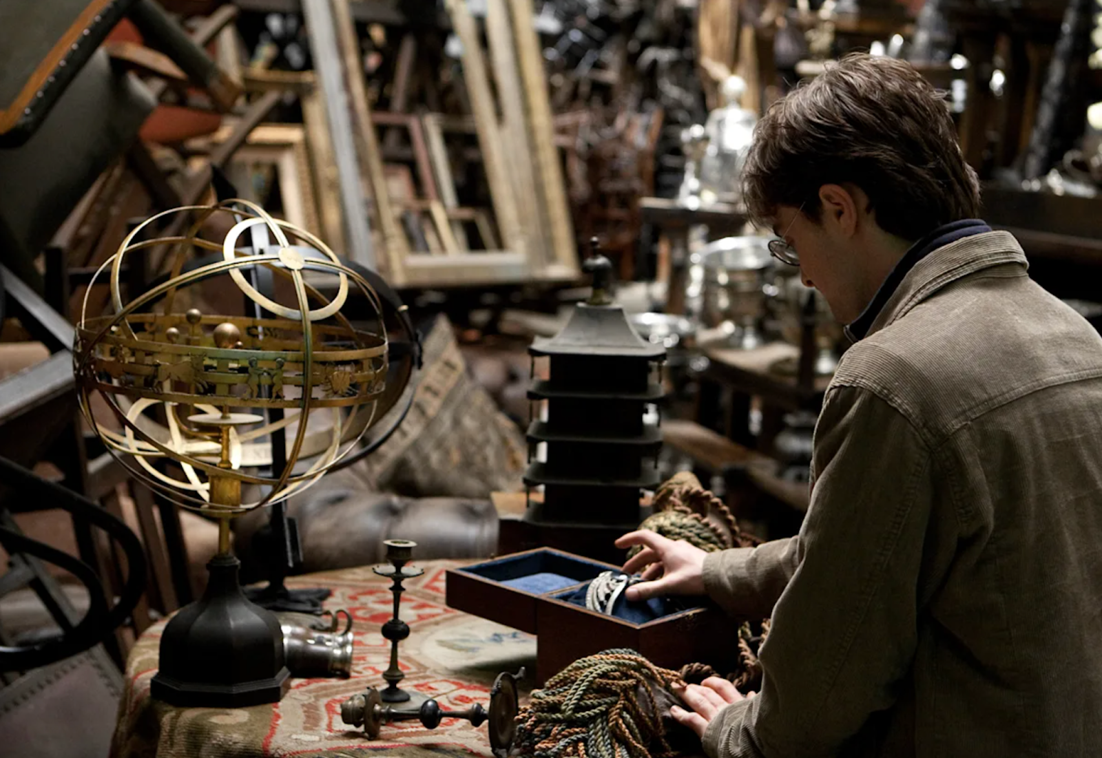 Scene from a Harry Potter film of Harry inside the Room of Requirement, surrounded by stacks of magical objects — symbolizing how AI can reveal the right tools to create more accessible digital experiences.