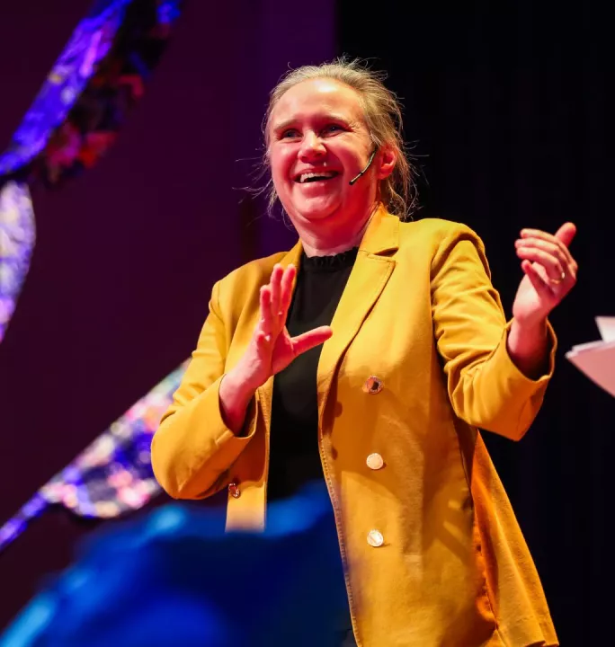 Picture of Mieke De Ketelaere speaking on the stage of the KIT Royal Tropical Institute.
